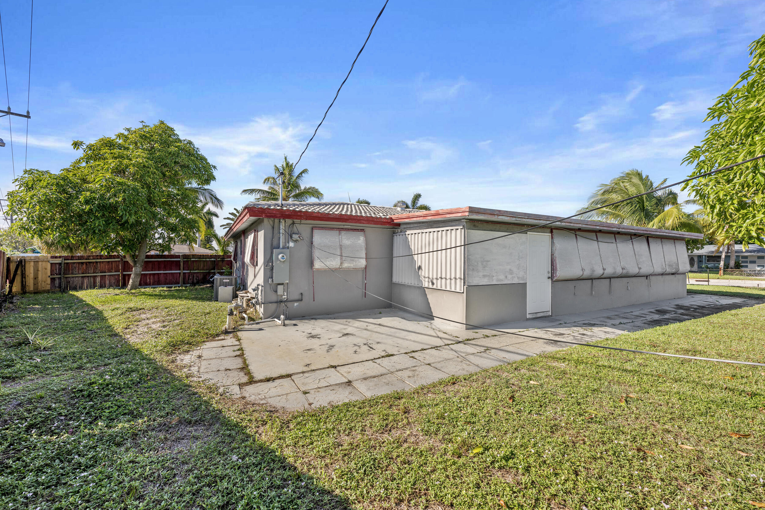 490 West 31st Street Riviera Beach, FL 33404 - Photo 23 of 29 a view of a house with a yard