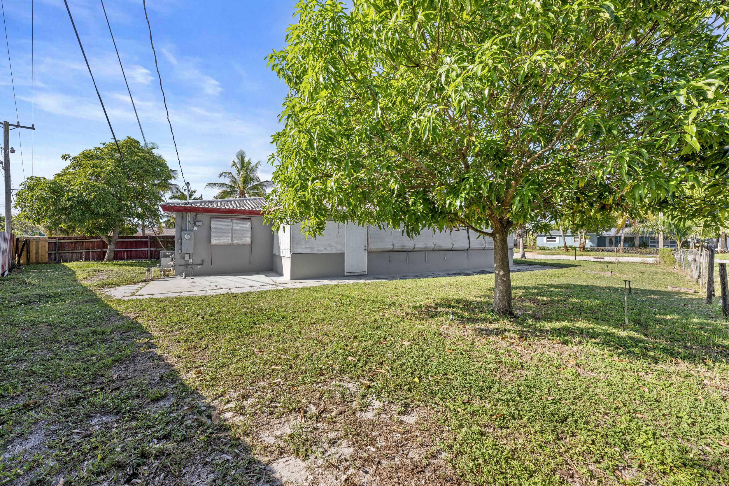 490 West 31st Street Riviera Beach, FL 33404 - Photo 24 of 29 a house view with a garden space