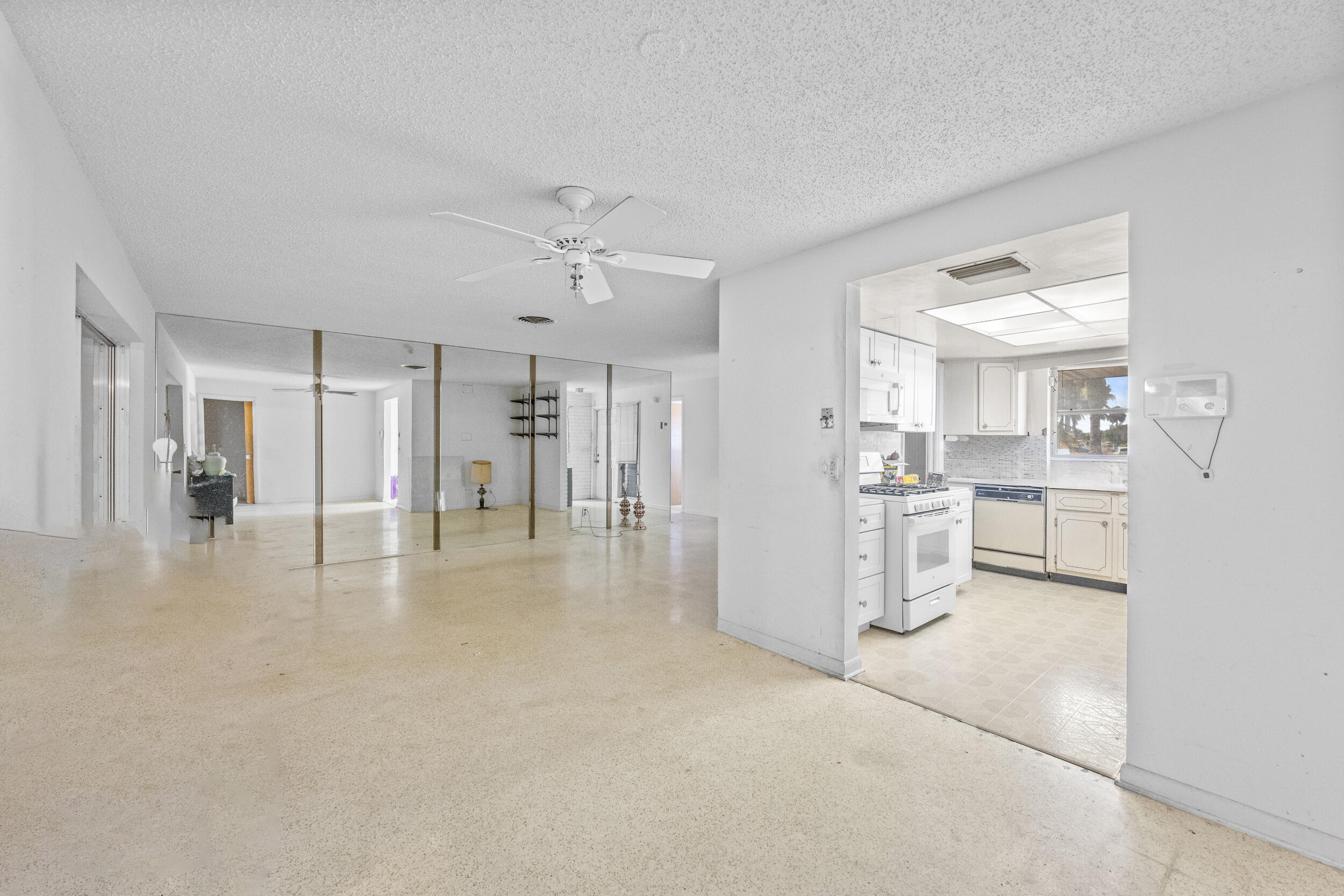 490 West 31st Street Riviera Beach, FL 33404 - Photo 7 of 29 a view of a kitchen with refrigerator and windows