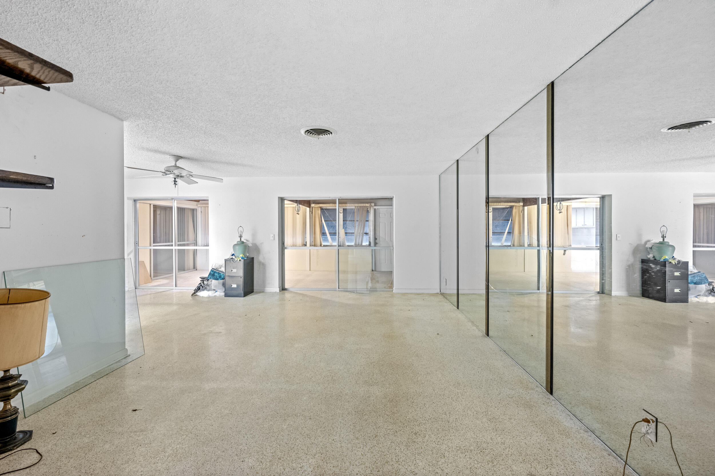 490 West 31st Street Riviera Beach, FL 33404 - Photo 8 of 29 a view of an empty room with window and chandelier