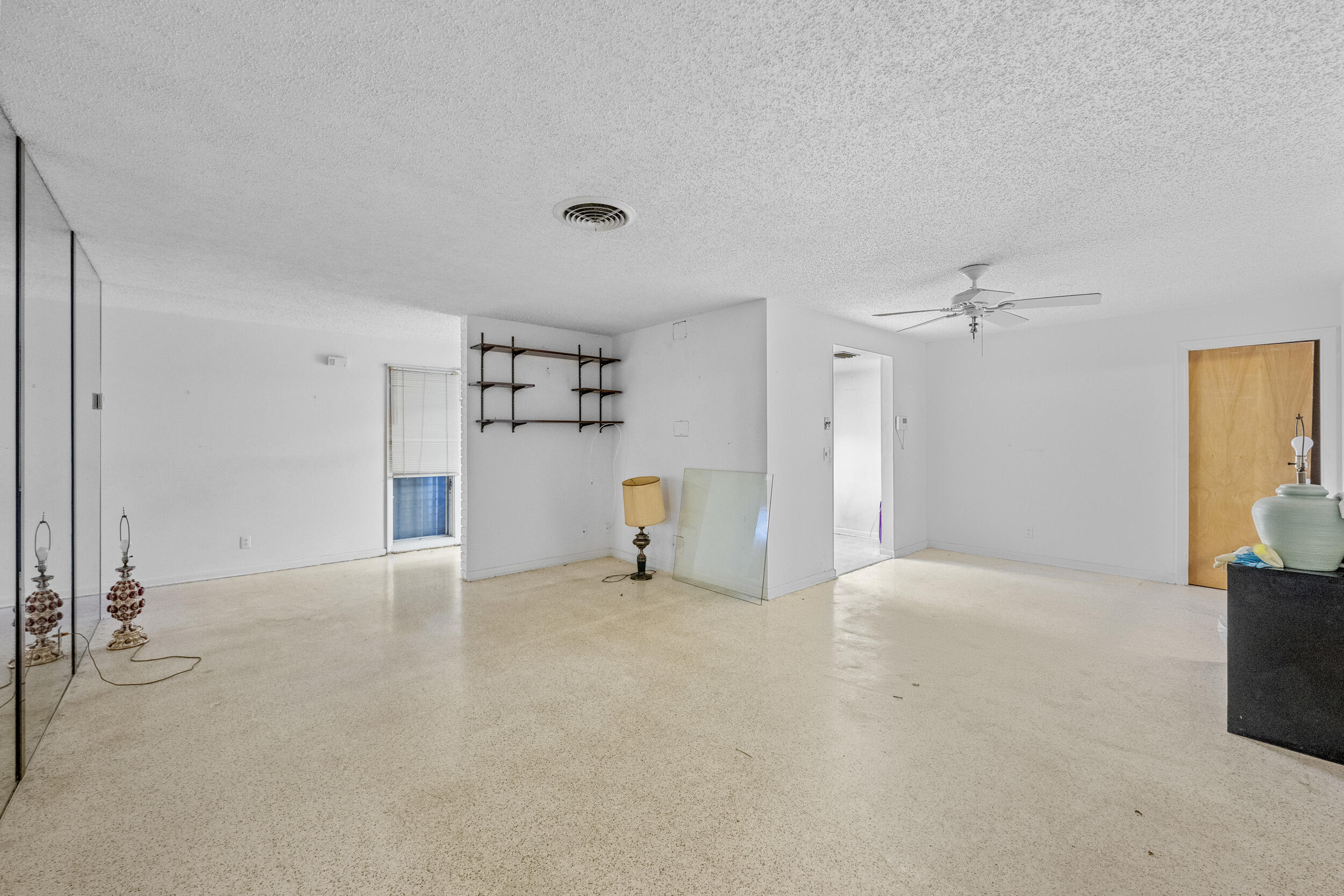 490 West 31st Street Riviera Beach, FL 33404 - Photo 9 of 29 a view of empty room with wooden floor