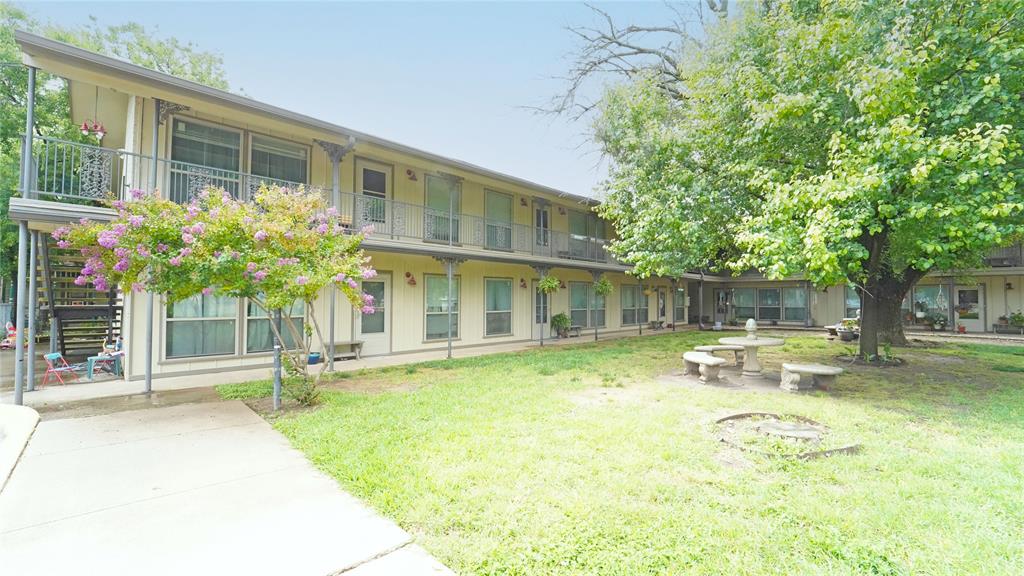 202 East Oak Street, Unit 12 Weatherford, TX 76086 - Photo 1 of 8 a view of a house with swimming pool and sitting area