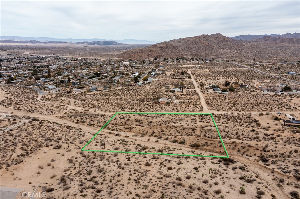 7183 Outpost Road Joshua Tree, CA 92252 - Photo 1 of 1 an aerial view of residential house and green space