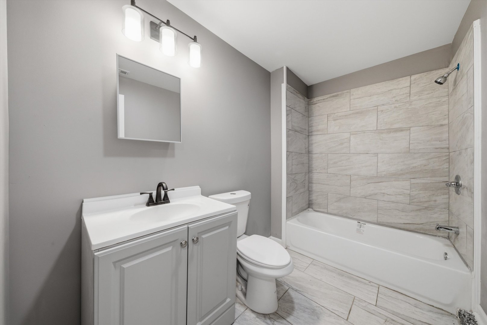 7828 South Escanaba Avenue Chicago, IL 60649 - Photo 30 of 41 a bathroom with a sink toilet and shower