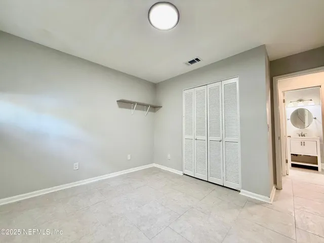 an empty room with closet