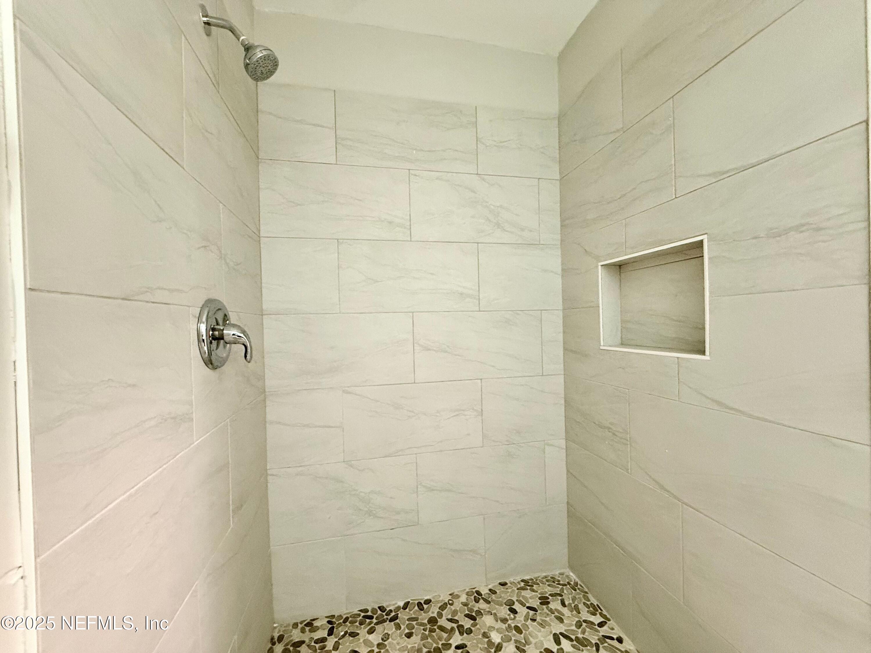 3801 Crown Point Road, Unit 1074 Jacksonville, FL 32257 - Photo 18 of 22 a bathroom with a shower