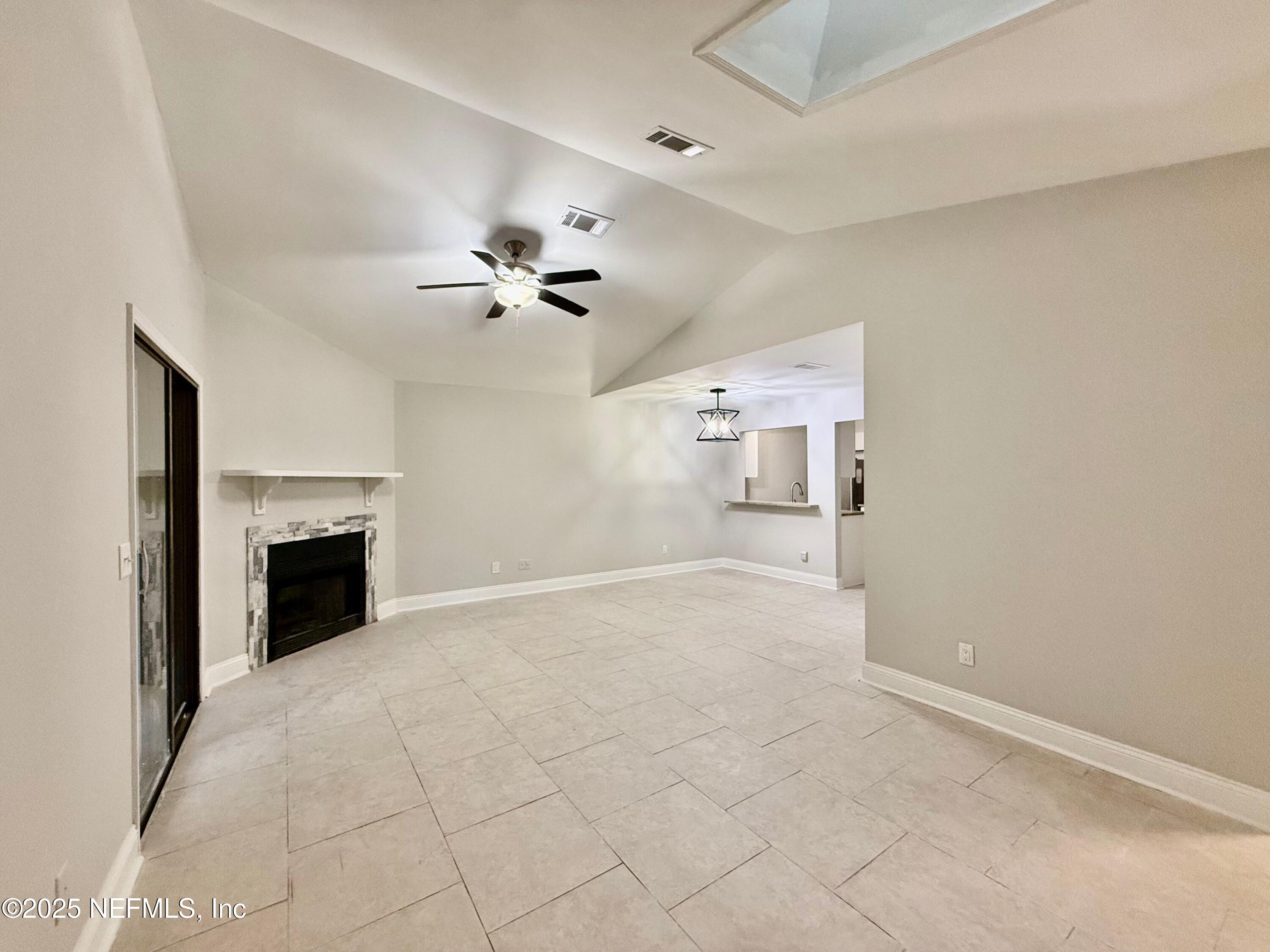 3801 Crown Point Road, Unit 1074 Jacksonville, FL 32257 - Photo 3 of 22 a view of an empty room with a fireplace