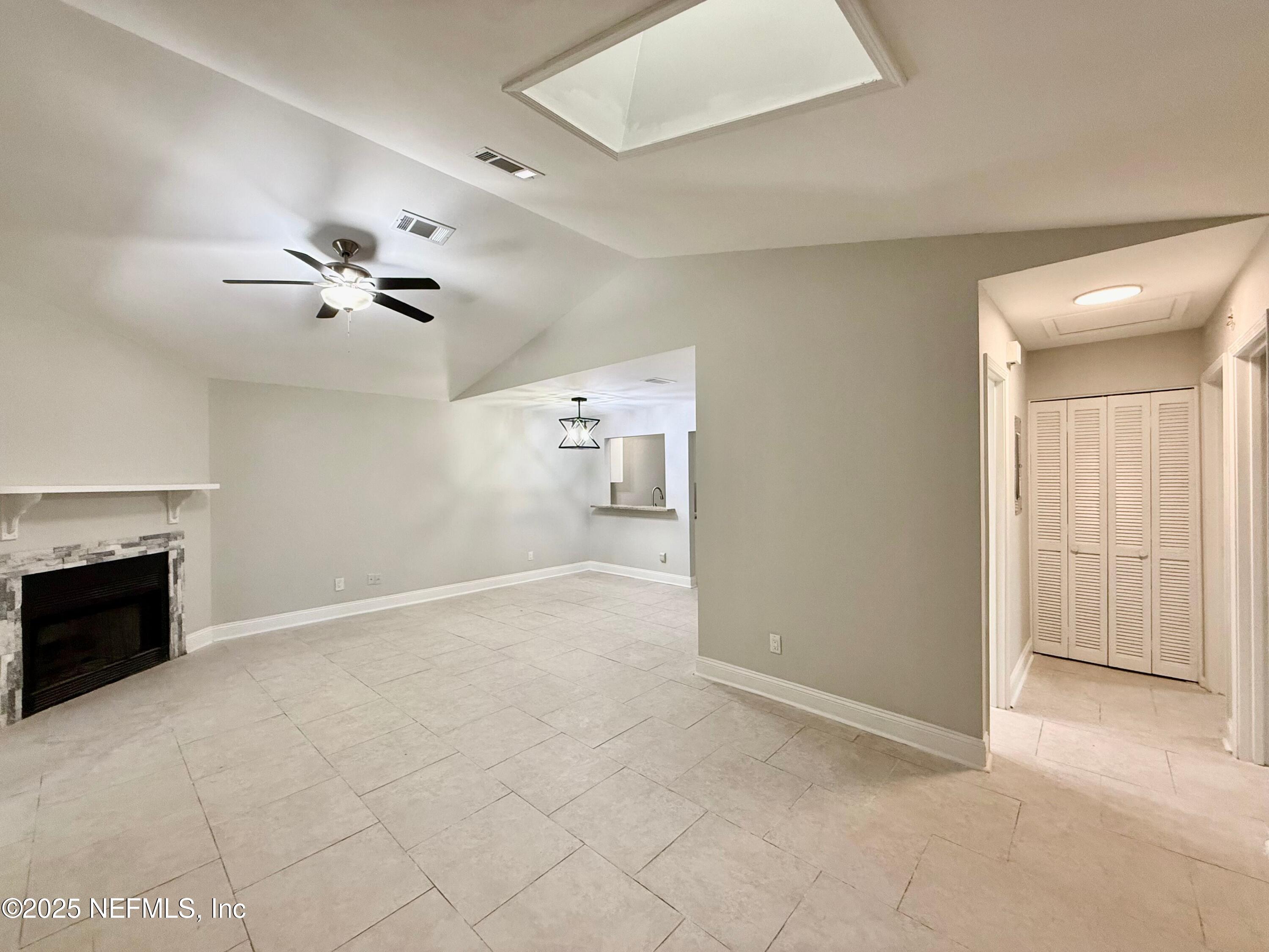 3801 Crown Point Road, Unit 1074 Jacksonville, FL 32257 - Photo 4 of 22 a view of an empty room with a fireplace