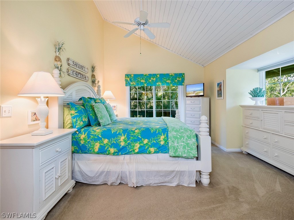 974 Sand Castle Road Sanibel, FL 33957 - Photo 11 of 31 a bed room with a bed and a window