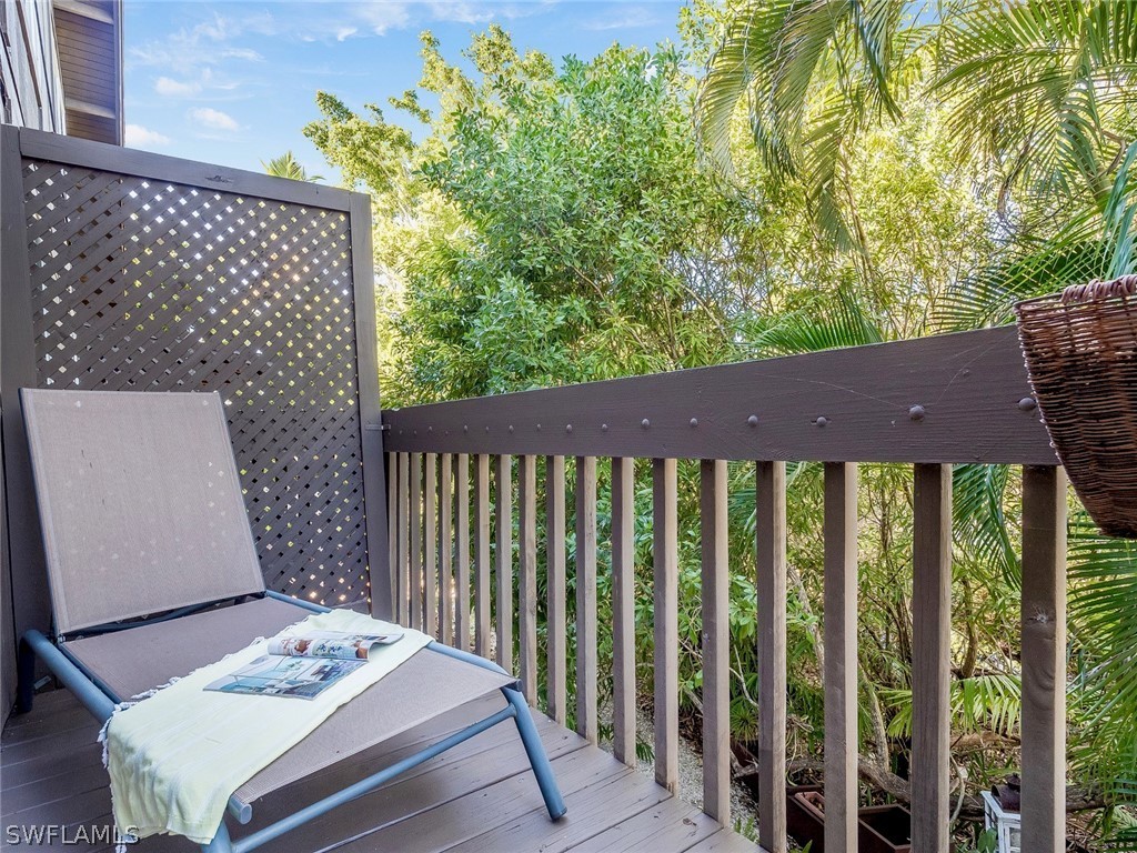 974 Sand Castle Road Sanibel, FL 33957 - Photo 13 of 31 a view of a wooden bench in patio