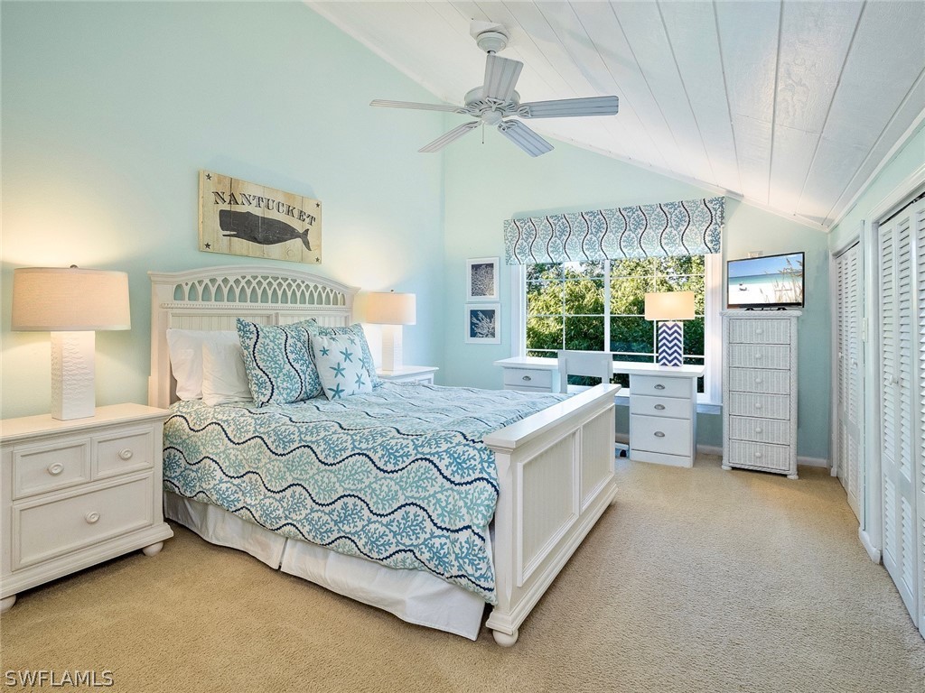 974 Sand Castle Road Sanibel, FL 33957 - Photo 17 of 31 a spacious bedroom with a bed and a large window