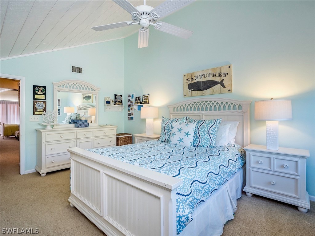 974 Sand Castle Road Sanibel, FL 33957 - Photo 18 of 31 a bedroom with a bed and a dresser