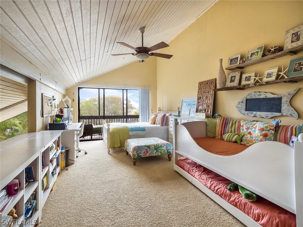 974 Sand Castle Road Sanibel, FL 33957 - Photo 21 of 31 a bedroom with furniture and a large window