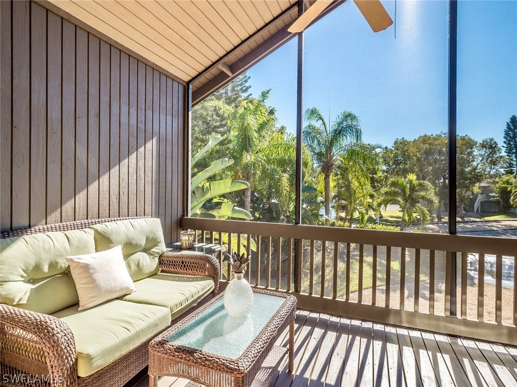 974 Sand Castle Road Sanibel, FL 33957 - Photo 3 of 31 a balcony with furniture and a potted plant