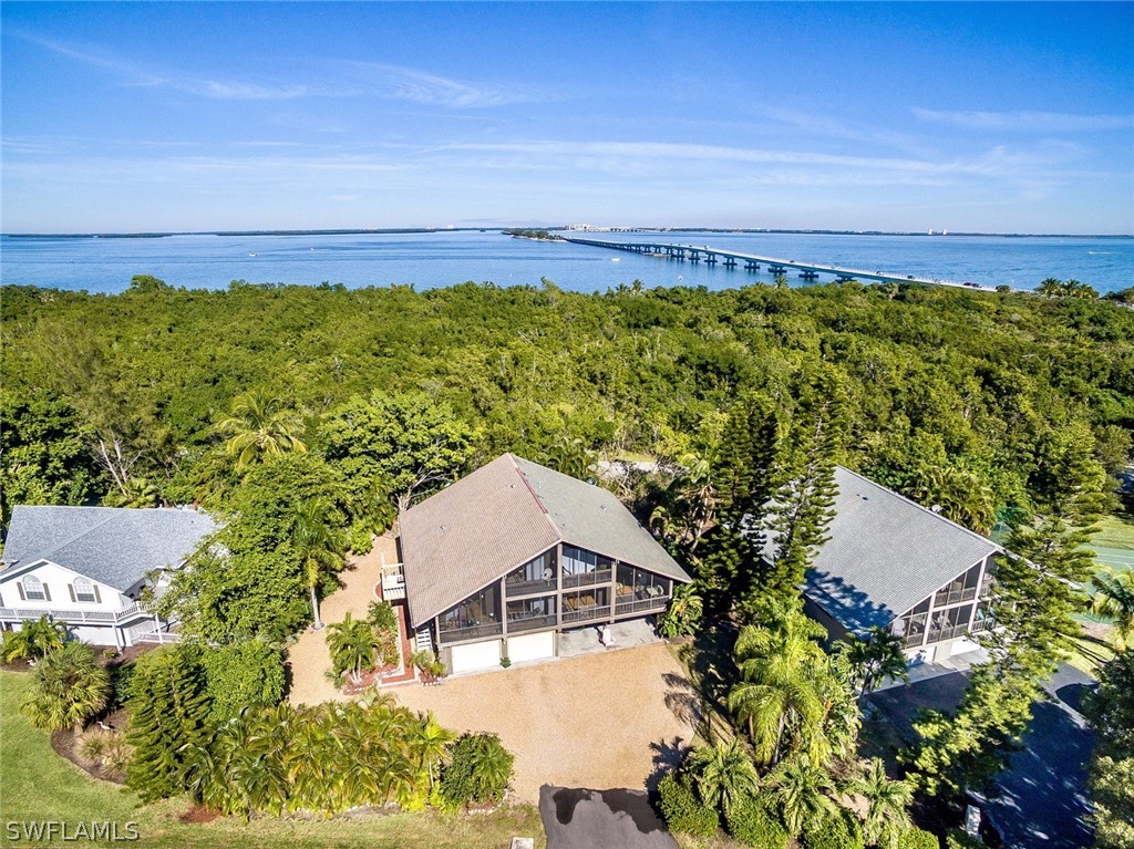 974 Sand Castle Road Sanibel, FL 33957 - Photo 31 of 31 an aerial view of a house with a yard