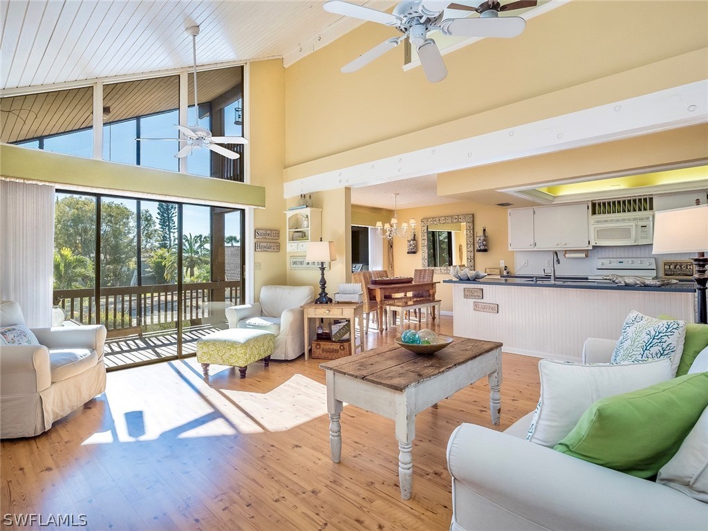 974 Sand Castle Road Sanibel, FL 33957 - Photo 5 of 31 a living room with furniture and a large window