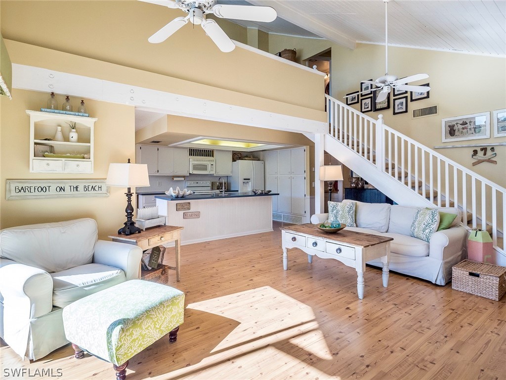 974 Sand Castle Road Sanibel, FL 33957 - Photo 6 of 31 a living room with furniture and wooden floor