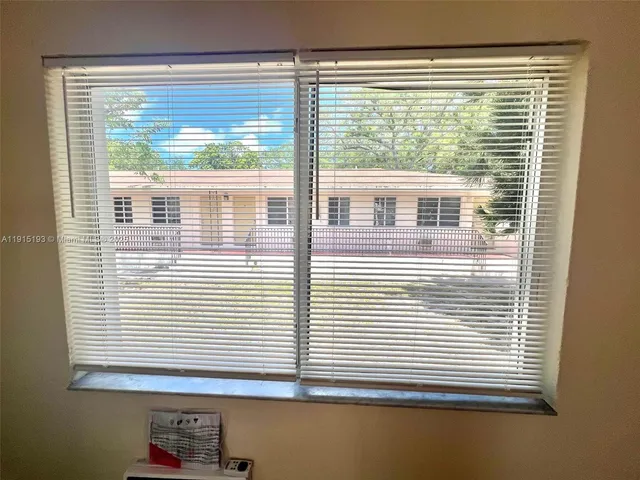 a view of a room that has a window