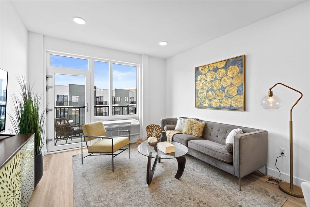 a living room with furniture and a large window