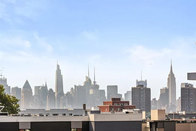 a view of a city with tall buildings