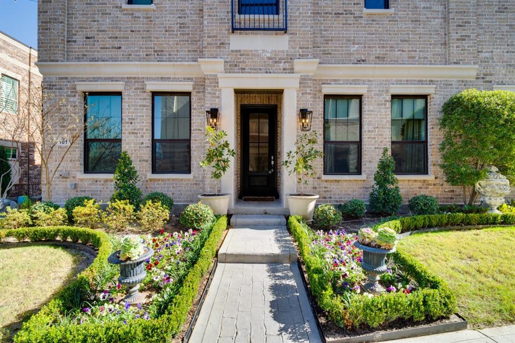 307 Sunset Lane, Unit 101 Fort Worth, TX 76114 - Photo 1 of 37 a front view of a house with a garden