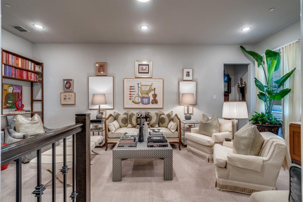 307 Sunset Lane, Unit 101 Fort Worth, TX 76114 - Photo 20 of 37 a living room with furniture and a flat screen tv