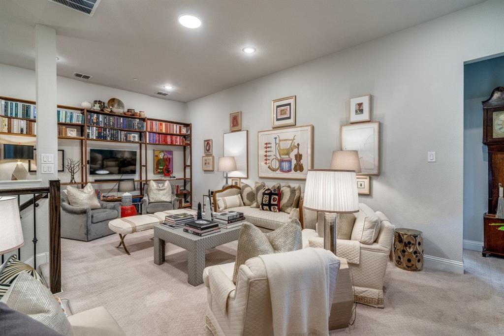 307 Sunset Lane, Unit 101 Fort Worth, TX 76114 - Photo 21 of 37 a living room with furniture and a book shelf