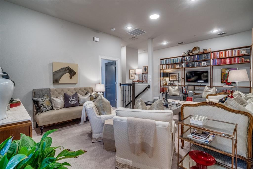 307 Sunset Lane, Unit 101 Fort Worth, TX 76114 - Photo 22 of 37 a living room with furniture a gym equipment and a flat screen tv