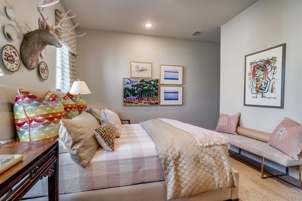 307 Sunset Lane, Unit 101 Fort Worth, TX 76114 - Photo 29 of 37 a bedroom with a bed and a chandelier