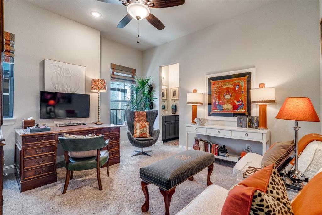 307 Sunset Lane, Unit 101 Fort Worth, TX 76114 - Photo 32 of 37 a living room with furniture a flat screen tv and a fireplace