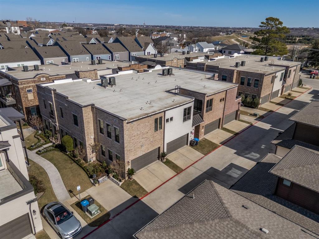 307 Sunset Lane, Unit 101 Fort Worth, TX 76114 - Photo 35 of 37 an aerial view of a house with a patio