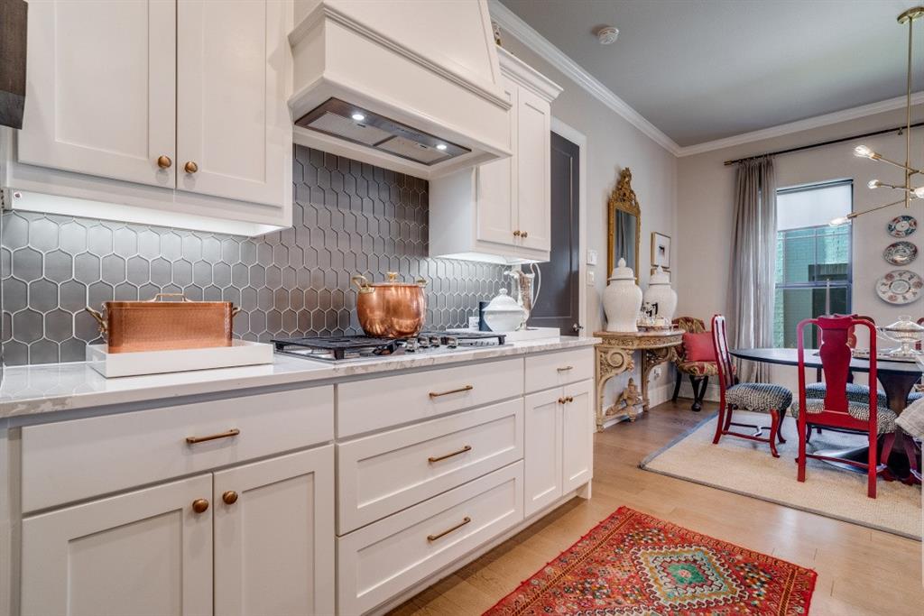 307 Sunset Lane, Unit 101 Fort Worth, TX 76114 - Photo 10 of 37 a kitchen with cabinets appliances and a counter top space