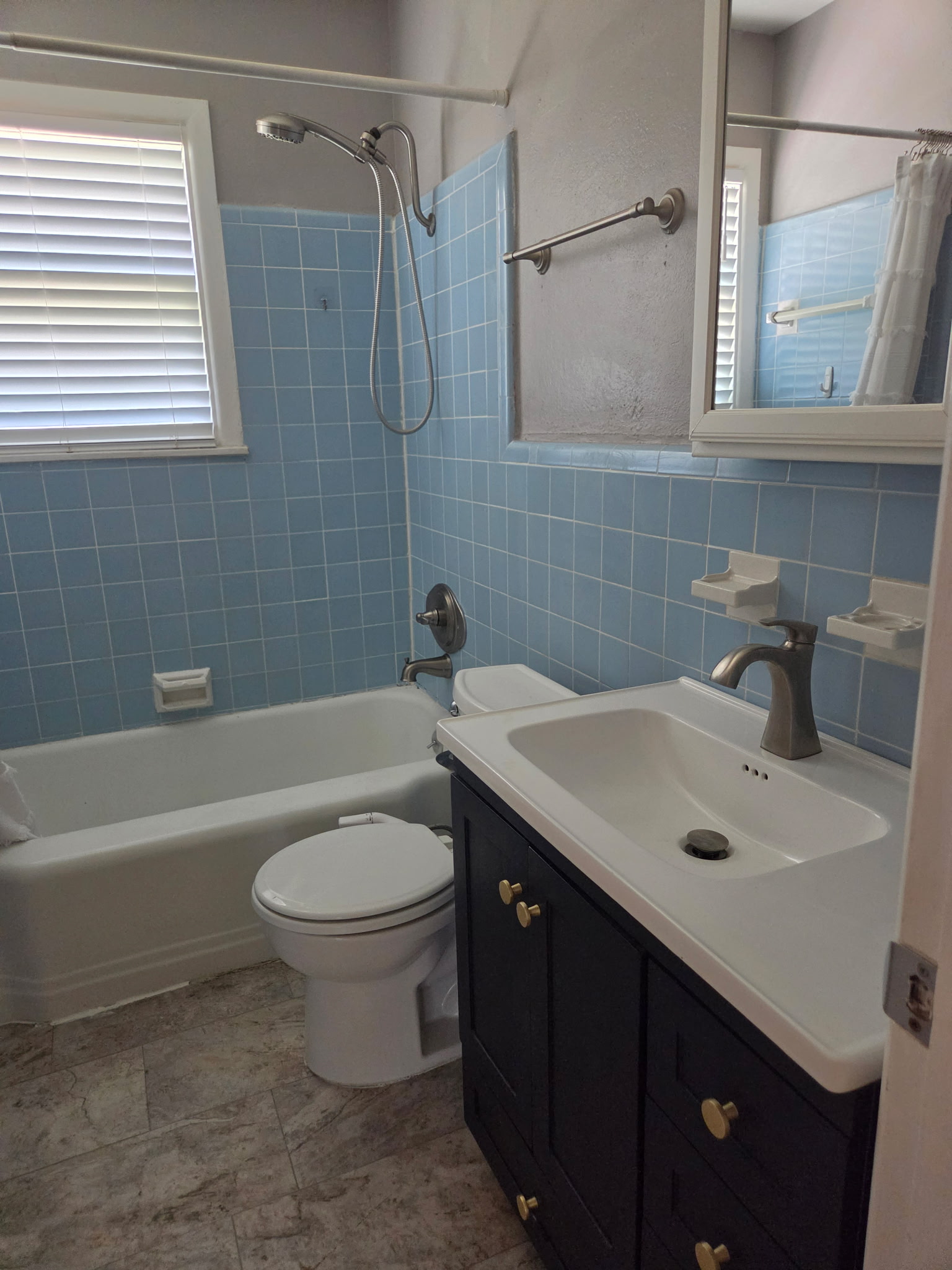 1818 South 39th Street Temple, TX 76504 - Photo 13 of 14 a bathroom with a sink toilet vanity and shower