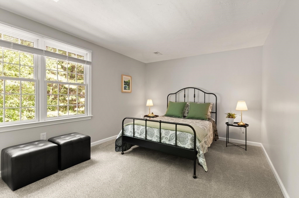 67 Bridle Path Franklin, MA 02038 - Photo 22 of 35 a bedroom with a bed couch and a window