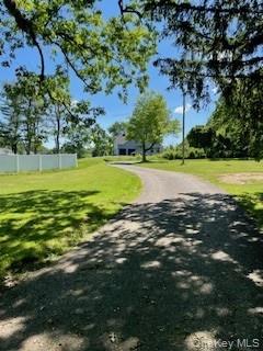 179 Riley Road New Windsor, NY 12553 - Photo 4 of 7 a view of a swimming pool with an outdoor space and seating area