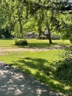 a view of a swimming pool with a yard