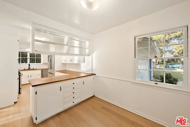 a room with a window and a sink