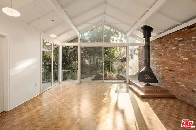 a view of an empty room with a balcony