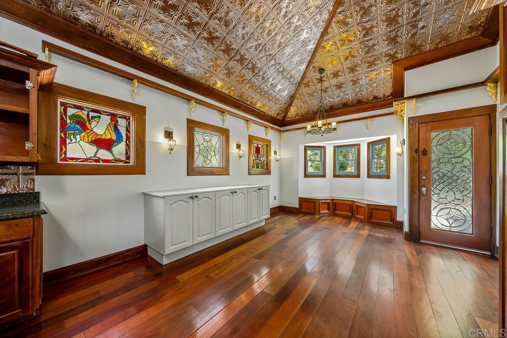 13510 Jamul Drive Jamul, CA 91935 - Photo 3 of 18 a view of an empty room with wooden floor and a window
