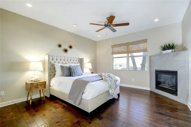 a bed room with a bed and a fireplace