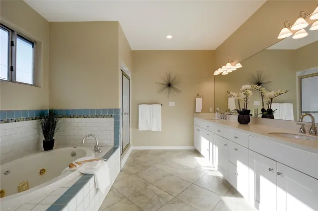 a bathroom with a bathtub and a sink