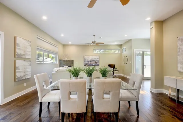 a view of a dining room with furniture and wooden floor