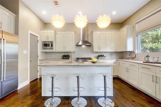 a kitchen with a sink cabinets and window