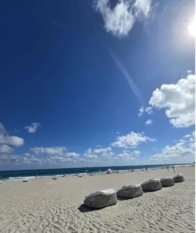 a view of roof deck with patio