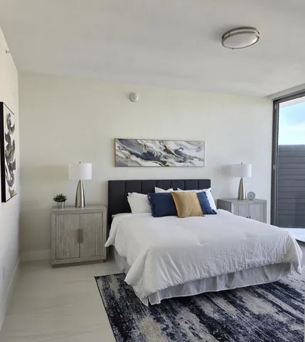 a bedroom with double bed and two night stand