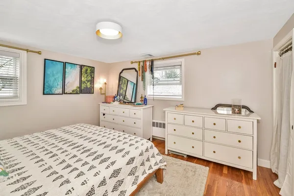 a bedroom with a bed and a dresser
