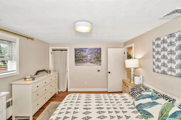 a bedroom with a bed and a window in it