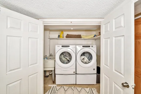 a utility room with dryer and washer