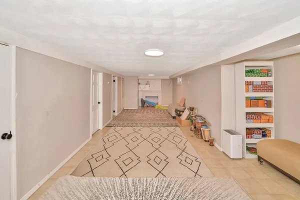 a bed room with a bed and a chair