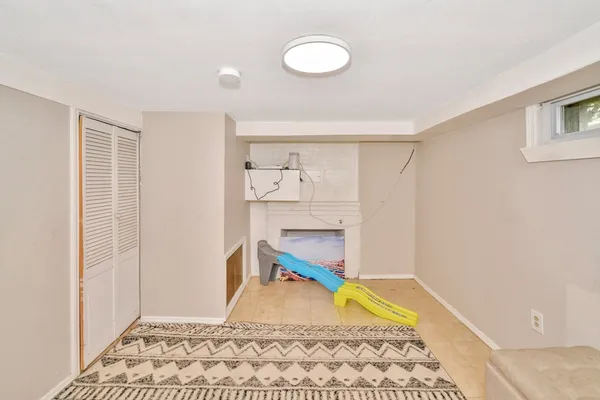 a room with a washing machine and a window